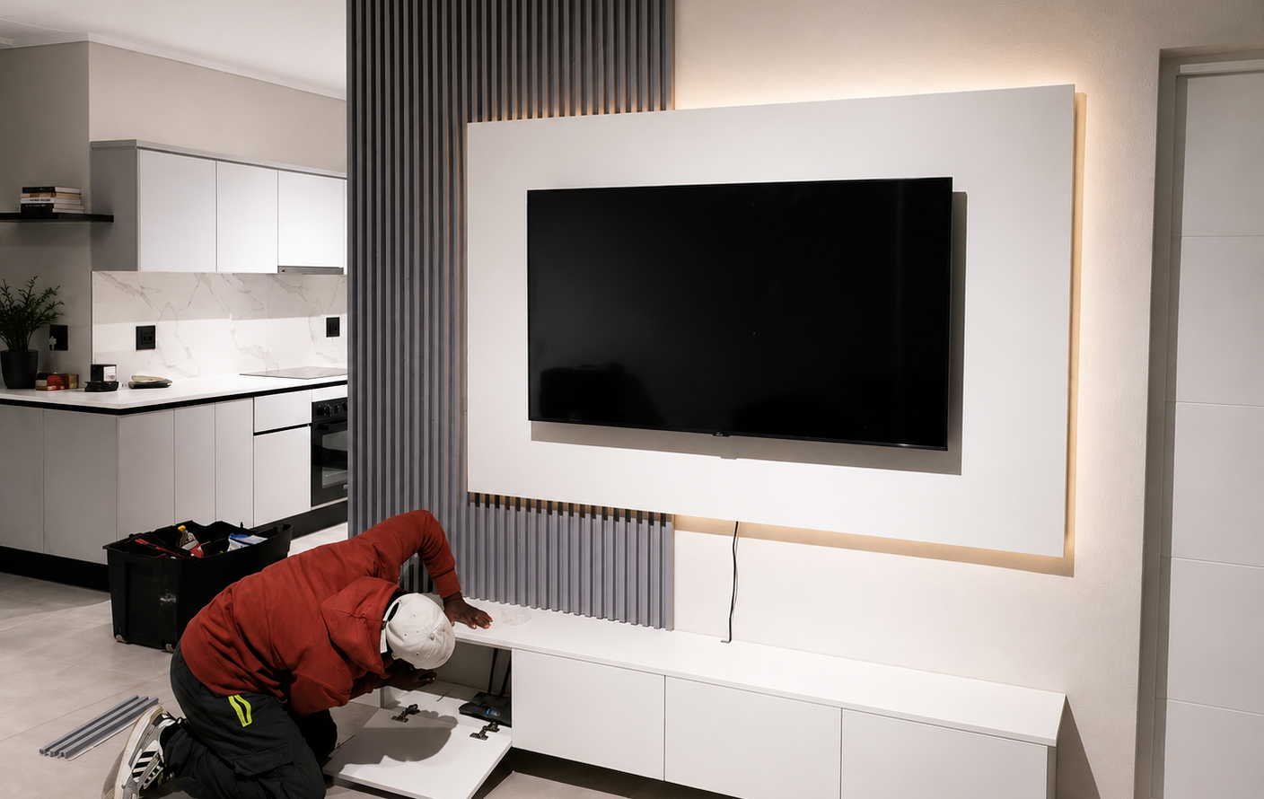 TT Home Furnishings team installing a custom TV feature wall